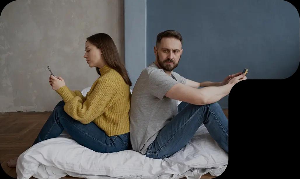 Couple sitting back-to-back showing relationship conflict